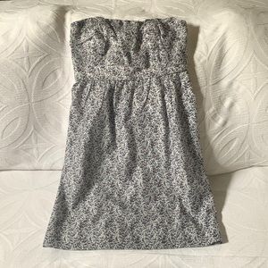 It is a strapless dress by J Crew.